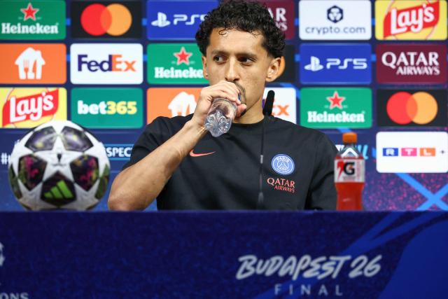 Paris Saint-Germain's Brazilian defender #05 Marquinhos takes a sip of water at the start of a MD-1 press conference on May 29, 2026, the eve of the UEFA Champions League final football match between Paris Saint-Germain (PSG) and Arsenal at the Puskas Arena in Budapest. Paris Saint-Germain (PSG) face Arsenal in the UEFA Champions League final football match on May 30, 2026 in Budapest. (Photo by FRANCK FIFE / POOL / AFP)