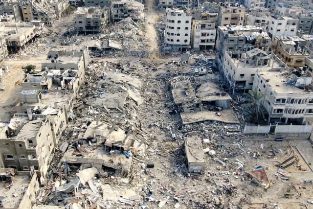 (FILES) An aerial view on December 26, 2023 shows destroyed buildings in Beit Lahia following Israeli bombardments in the northern Gaza Strip, amid ongoing battles between Israel and the Palestinian militant group Hamas. Professional photo and video journalists working in Gaza are to receive an annual press freedom award on June 1, 2026 for risking their lives to report on the war, an association of publishers has said. AFP photographer Mohammed Abed, who worked in Gaza until April 2024 before joining its Cairo bureau, will be among those at the ceremony in the French city of Marseille. (Photo by Mohammed ABED / AFP)