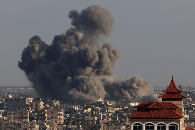 (FILES) A picture taken from Rafah shows smoke billowing over Khan Yunis in the southern Gaza Strip during Israeli bombardment on January 24, 2024, amid ongoing battles between Israel and the Palestinian militant group Hamas. Professional photo and video journalists working in Gaza are to receive an annual press freedom award on June 1, 2026 for risking their lives to report on the war, an association of publishers has said. AFP photographer Mohammed Abed, who worked in Gaza until April 2024 before joining its Cairo bureau, will be among those at the ceremony in the French city of Marseille. (Photo by Mohammed ABED / AFP)