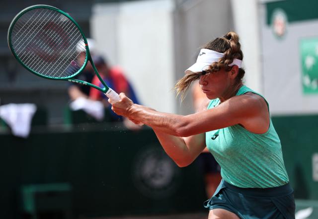 Argentina's Solana Sierra plays a backhand return to Romania's Sorana Cirstea during their women's singles match on day 6 of the French Open tennis tournament at the Roland-Garros Complex in Paris on May 29, 2026. (Photo by Anne-Christine POUJOULAT / AFP)