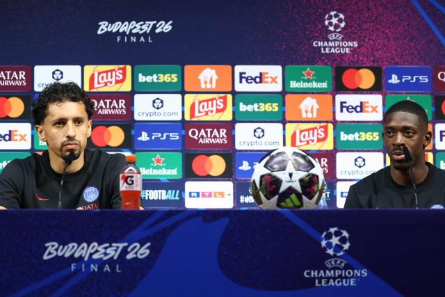 Paris Saint-Germain's French forward #10 Ousmane Dembele (R) and Paris Saint-Germain's Brazilian defender #05 Marquinhos attend a MD-1 press conference on May 29, 2026, the eve of the UEFA Champions League final football match between Paris Saint-Germain (PSG) and Arsenal at the Puskas Arena in Budapest. Paris Saint-Germain (PSG) face Arsenal in the UEFA Champions League final football match on May 30, 2026 in Budapest. (Photo by FRANCK FIFE / POOL / AFP)