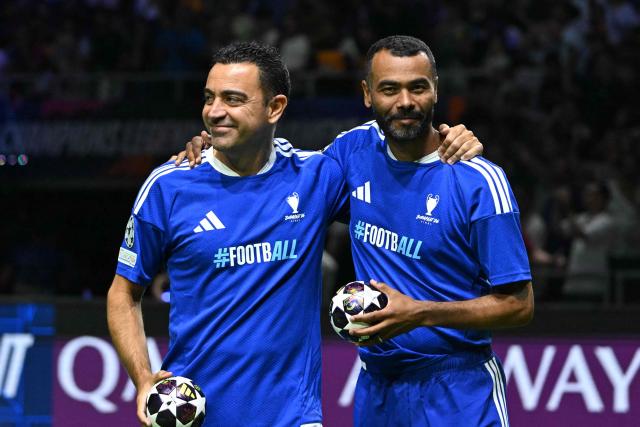Xavi Hernandez (L) and Ashley Cole share a smile prior to the Ultimate Champions Legends Tournament on May 29, 2026, at the Papp Laszlo Arena in Budapest, Hungary, on the eve of the UEFA Champions League final. (Photo by Attila KISBENEDEK / AFP)
