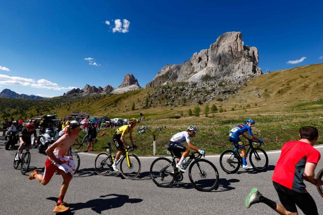 Lidl - Trek Italian rider Giulio Ciccone (R), Movistar Team Colombian rider Einer Rubio (C) and Team Visma Lease a Bike US rider Sepp Kuss (L) cycle in a breakaway in the ascent of Passo Giau during the 19th stage of the Giro d'Italia 2026 - Tour of Italy cycling race between Feltre and Alleghe, Italy, on May 29, 2026. (Photo by Luca Bettini / AFP)