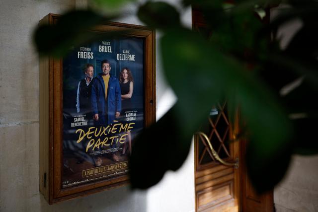 This photograph shows a theatre poster of a play entitled "Deuxieme Partie" starring French singer and actor Patrick Bruel displayed on the facade of the Theatre Edouard VII in Paris on May 29, 2026. A performance of the play "Deuxieme Partie" was briefly disrupted on the evening of May 27, 2026 in Paris by activists from the feminist collective Nous Toutes who had taken their seats in the Theatre Edouard VII, according to videos posted on social media. Patrick Bruel is currently facing four rape allegations in France and a judicial investigation into sexual assault in Belgium. He denies all the allegations against him. (Photo by SIMON WOHLFAHRT / AFP)