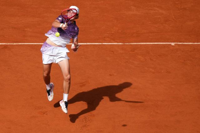 Brazil's Joao Fonseca plays a forehand return to Serbia's Novak Djokovic during their men's singles match on day 6 of the French Open tennis tournament on Court Philippe-Chatrier at the Roland-Garros Complex in Paris on May 29, 2026. (Photo by Dimitar DILKOFF / AFP)