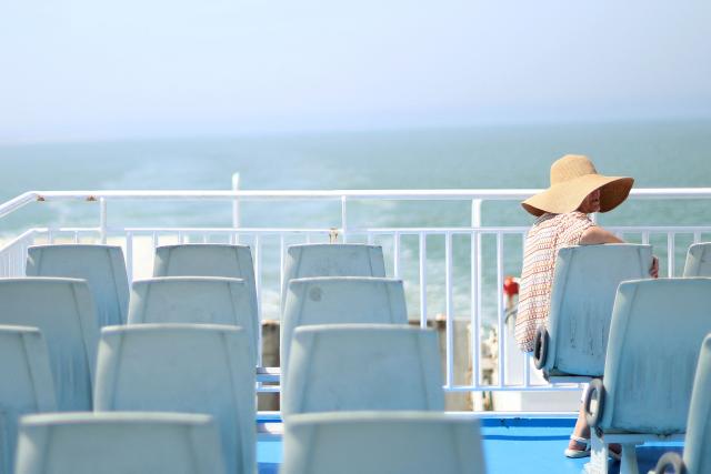 A passenger looks on while traveling on a ferry connecting Le Verdon-sur-Mer (Gironde) to Royan (Charente-Maritime) during an anti-drug trafficking operation, off the coast of Royan, south-western France on May 29, 2026. (Photo by ROMAIN PERROCHEAU / AFP)