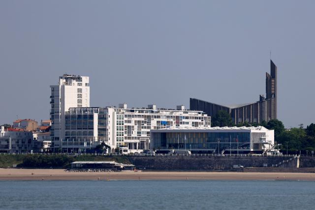This photograph shows a view of the Notre-Dame de Royan Church (R) in Royan as seen from the Atlantic Ocean, south-western France on May 29, 2026. (Photo by ROMAIN PERROCHEAU / AFP)