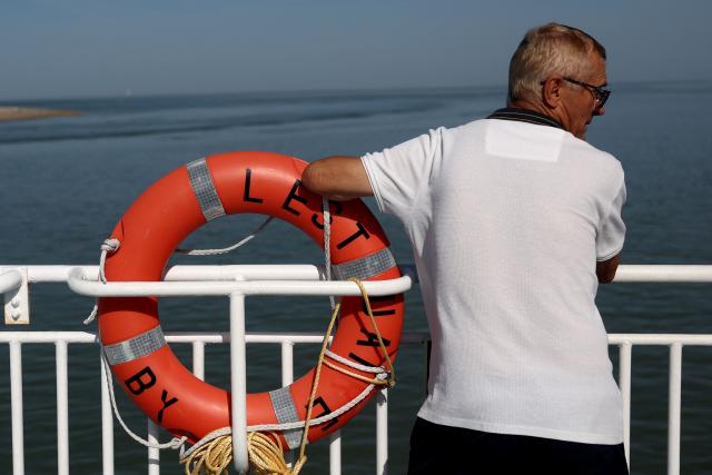 A passenger looks on while traveling on a ferry connecting Le Verdon-sur-Mer (Gironde) to Royan (Charente-Maritime) during an anti-drug trafficking operation, off the coast of Royan, south-western France on May 29, 2026. (Photo by ROMAIN PERROCHEAU / AFP)