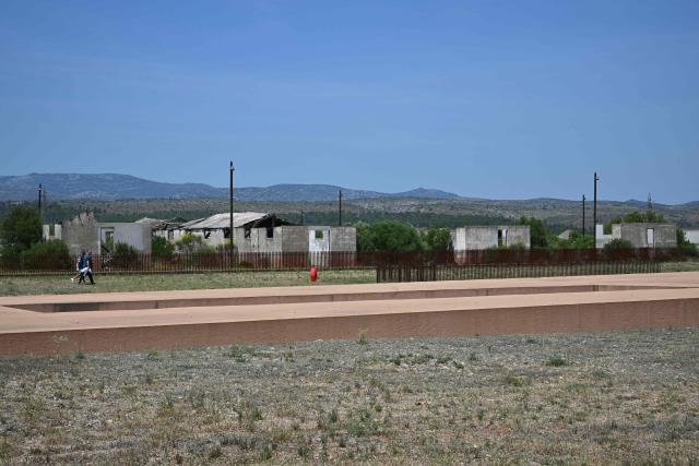 This photograph shows the Rivesaltes Camp Memorial inaugurated in October 2015 and built amidst the remains of the barracks, witnesses to the fate of more than 60,000 people on May 29, 2026 in Rivesaltes, southwestern France. Ten years after it opened, the Rivesaltes Camp Memorial Museum, a site that, throughout the 20th century, housed Spanish refugees, Jews, Roma and Harkis, is revamping its permanent exhibition, aiming to serve as a "bulwark" against tensions surrounding remembrance. (Photo by Lionel BONAVENTURE / AFP)