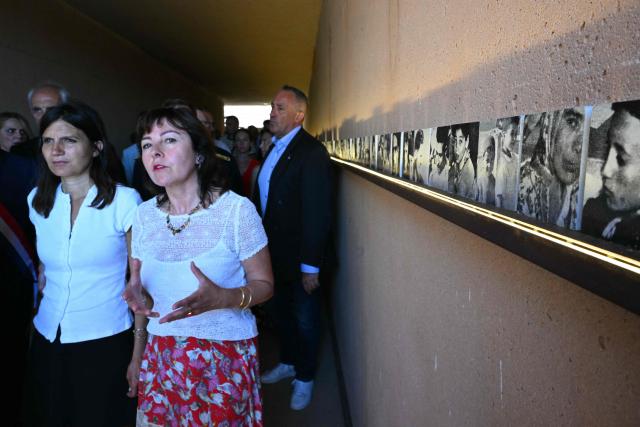President of the Occitanie Region Carole Delga (2ndL)and Minister Delegate to the Minister of the Armed Forces and Veterans Affairs  Alice Rufo (L) inaugurate the new permanent exhibition space of the Rivesaltes Camp Memorial on May 29, 2026 in Rivesaltes, southwestern France. Ten years after it opened, the Rivesaltes Camp Memorial Museum, a site that, throughout the 20th century, housed Spanish refugees, Jews, Roma and Harkis, is revamping its permanent exhibition, aiming to serve as a "bulwark" against tensions surrounding remembrance. (Photo by Lionel BONAVENTURE / AFP)