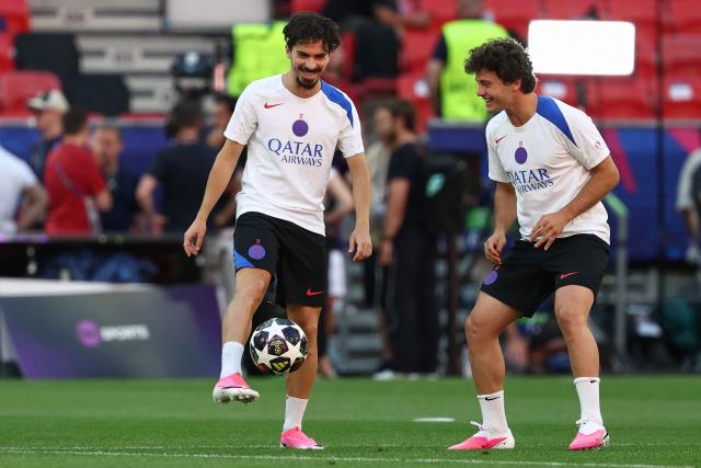 Paris Saint-Germain's Portuguese midfielder #17 Vitinha (L) and Paris Saint-Germain's Portuguese midfielder #87 Joao Neves take part in a MD-1 training session of his players on May 29, 2026, the eve of the UEFA Champions League final football match between Paris Saint-Germain (PSG) and Arsenal at the Puskas Arena in Budapest. Paris Saint-Germain (PSG) face Arsenal in the UEFA Champions League final football match on May 30, 2026 in Budapest. (Photo by FRANCK FIFE / AFP)
