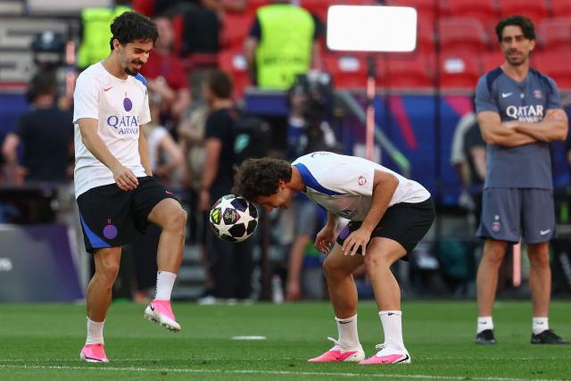 Paris Saint-Germain's Portuguese midfielder #17 Vitinha (L) and Paris Saint-Germain's Portuguese midfielder #87 Joao Neves take part in a MD-1 training session of his players on May 29, 2026, the eve of the UEFA Champions League final football match between Paris Saint-Germain (PSG) and Arsenal at the Puskas Arena in Budapest. Paris Saint-Germain (PSG) face Arsenal in the UEFA Champions League final football match on May 30, 2026 in Budapest. (Photo by FRANCK FIFE / AFP)