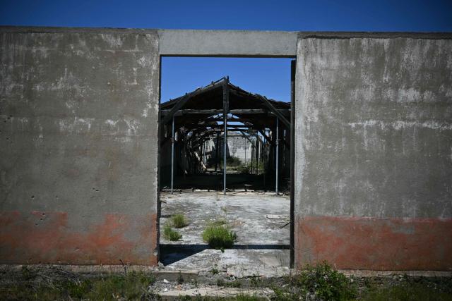 This photograph shows the Rivesaltes Camp Memorial inaugurated in October 2015 and built amidst the remains of the barracks, witnesses to the fate of more than 60,000 people on May 29, 2026 in Rivesaltes, southwestern France. Ten years after it opened, the Rivesaltes Camp Memorial Museum, a site that, throughout the 20th century, housed Spanish refugees, Jews, Roma and Harkis, is revamping its permanent exhibition, aiming to serve as a "bulwark" against tensions surrounding remembrance. (Photo by Lionel BONAVENTURE / AFP)