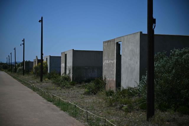 This photograph shows the Rivesaltes Camp Memorial inaugurated in October 2015 and built amidst the remains of the barracks, witnesses to the fate of more than 60,000 people on May 29, 2026 in Rivesaltes, southwestern France. Ten years after it opened, the Rivesaltes Camp Memorial Museum, a site that, throughout the 20th century, housed Spanish refugees, Jews, Roma and Harkis, is revamping its permanent exhibition, aiming to serve as a "bulwark" against tensions surrounding remembrance. (Photo by Lionel BONAVENTURE / AFP)