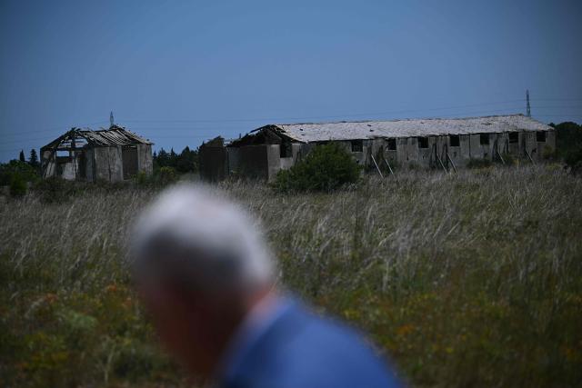 This photograph shows the Rivesaltes Camp Memorial inaugurated in October 2015 and built amidst the remains of the barracks, witnesses to the fate of more than 60,000 people on May 29, 2026 in Rivesaltes, southwestern France. Ten years after it opened, the Rivesaltes Camp Memorial Museum, a site that, throughout the 20th century, housed Spanish refugees, Jews, Roma and Harkis, is revamping its permanent exhibition, aiming to serve as a "bulwark" against tensions surrounding remembrance. (Photo by Lionel BONAVENTURE / AFP)
