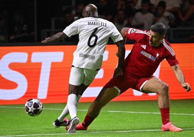 Former French football players Claude Makelele (L) and Robert Pires vie for the ball during the Ultimate Champions Legends Tournament on May 29, 2026, at the Papp Laszlo Arena in Budapest on the eve of the UEFA Champions League final. (Photo by Attila KISBENEDEK / AFP)