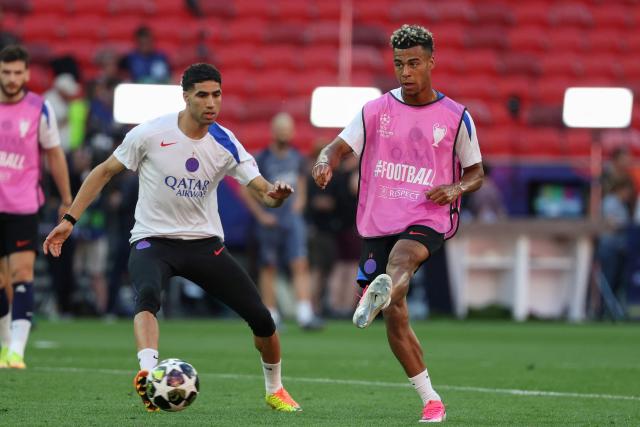 Paris Saint-Germain's Moroccan defender #02 Achraf Hakimi and  Paris Saint-Germain's French midfielder #14 Desire Doue take part in a MD-1 training session of his players on May 29, 2026, the eve of the UEFA Champions League final football match between Paris Saint-Germain (PSG) and Arsenal at the Puskas Arena in Budapest. Paris Saint-Germain (PSG) face Arsenal in the UEFA Champions League final football match on May 30, 2026 in Budapest. (Photo by FRANCK FIFE / AFP)