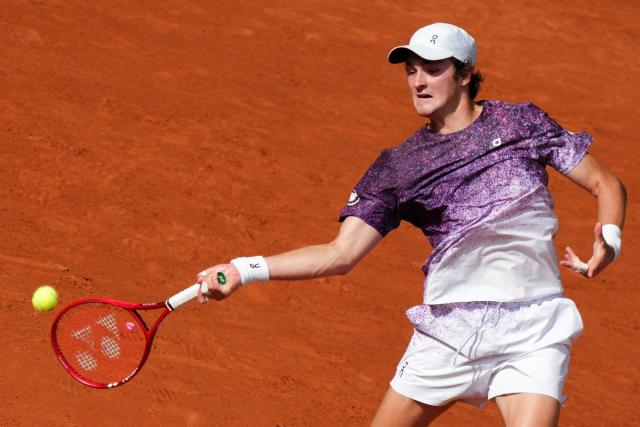 Brazil's Joao Fonseca plays a forehand return to Serbia's Novak Djokovic during their men's singles match on day 6 of the French Open tennis tournament on Court Philippe-Chatrier at the Roland-Garros Complex in Paris on May 29, 2026. (Photo by Dimitar DILKOFF / AFP)
