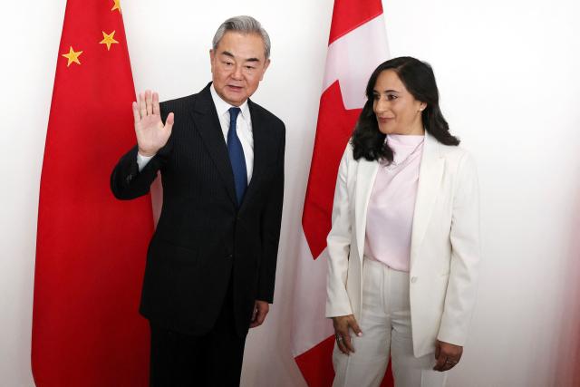 Canada's Minister of Foreign Affairs Anita Anand (R) and China's Minister of Foreign Affairs Wang Yi pose for a photo ahead of a bilateral meeting in Ottawa, on May 29, 2026. Wang will be the first Chinese foreign minister to visit Canada since 2016. (Photo by Dave Chan / AFP)