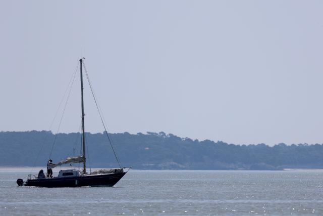 This photograph shows a sailboat sailing on the Altantic Ocean off the coast of Royan, south-western France on May 29, 2026. (Photo by ROMAIN PERROCHEAU / AFP)