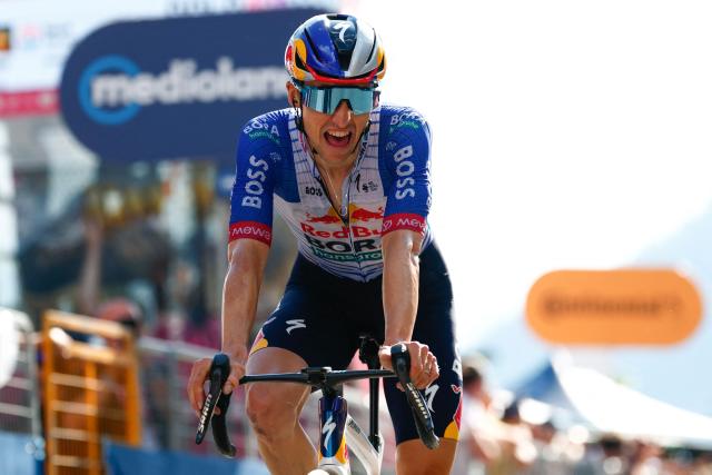 Red Bull - BORA - hansgrohe Australian rider Jai Hindley crosses the finish line of the 19th stage of the Giro d'Italia 2026 - Tour of Italy cycling race between Feltre and Alleghe, Italy, on May 29, 2026. (Photo by Luca Bettini / AFP)