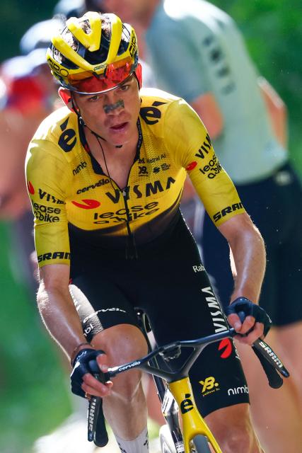Team Visma Lease a Bike US rider Sepp Kuss cycles in a lone breakaway in the final ascent to win the 19th stage of the Giro d'Italia 2026 - Tour of Italy cycling race between Feltre and Alleghe, Italy, on May 29, 2026. (Photo by Luca Bettini / AFP)
