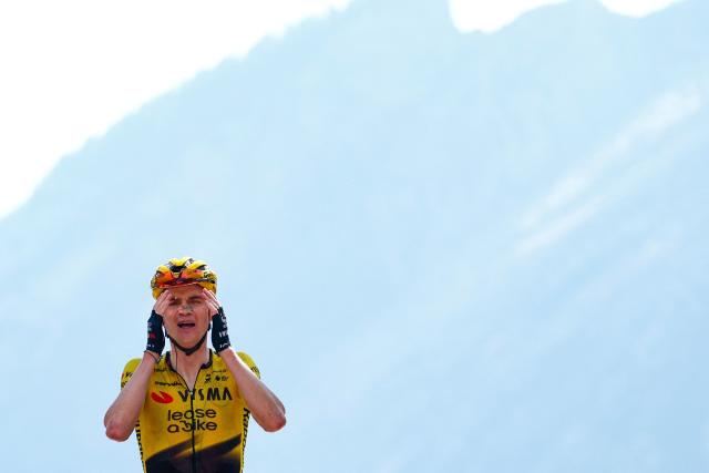 Team Visma Lease a Bike US rider Sepp Kuss celebrates as he crosses the finish line to win the 19th stage of the Giro d'Italia 2026 - Tour of Italy cycling race between Feltre and Alleghe, Italy, on May 29, 2026. (Photo by Luca Bettini / AFP)