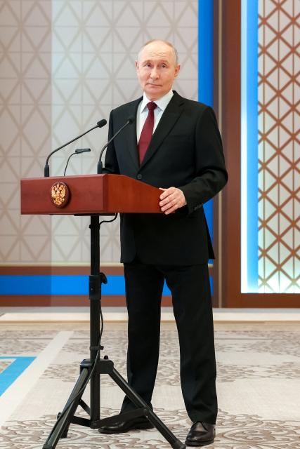 In this pool photograph distributed by the Russian state agency Sputnik Russia's President Vladimir Putin addresses a press-conference during his state visit to Kazakhstan at the Palace of Independence in Astana on May 29, 2026. (Photo by POOL / AFP)