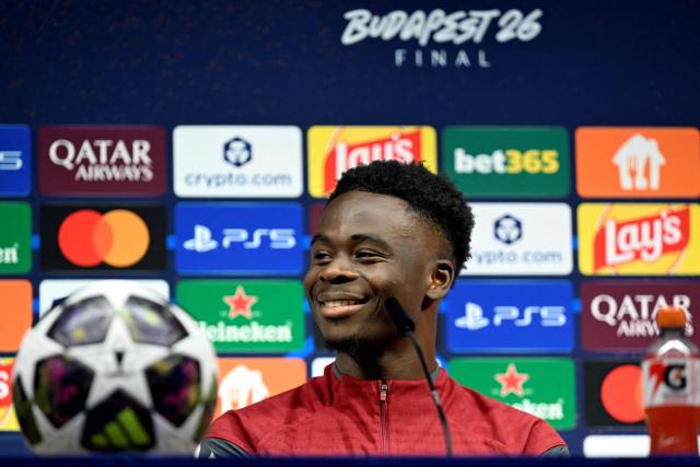 Arsenal's English midfielder #07 Bukayo Saka addresses a MD-1 press conference on May 29, 2026, the eve of the UEFA Champions League final football match between Paris Saint-Germain (PSG) and Arsenal at the Puskas Arena in Budapest. Paris Saint-Germain (PSG) face Arsenal in the UEFA Champions League final football match on May 30, 2026 in Budapest. (Photo by INA FASSBENDER / POOL / AFP)