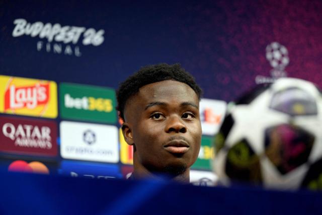 Arsenal's English midfielder #07 Bukayo Saka addresses a MD-1 press conference on May 29, 2026, the eve of the UEFA Champions League final football match between Paris Saint-Germain (PSG) and Arsenal at the Puskas Arena in Budapest. Paris Saint-Germain (PSG) face Arsenal in the UEFA Champions League final football match on May 30, 2026 in Budapest. (Photo by INA FASSBENDER / POOL / AFP)