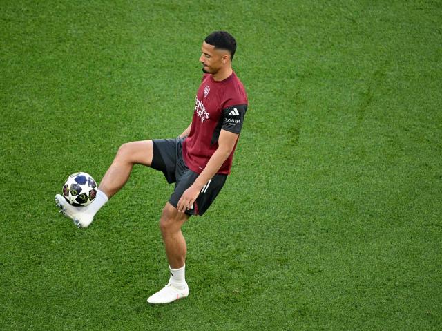 Arsenal's French defender #02 William Saliba plays the ball during a MD-1 training session at the Puskas Arena in Budapest on May 29, 2026, on the eve of the UEFA Champions League final football match between Paris Saint-Germain (PSG) and Arsenal FC. Paris Saint-Germain (PSG) face Arsenal in the UEFA Champions League final football match on May 30, 2026 in Budapest. (Photo by NICOLAS TUCAT / AFP)