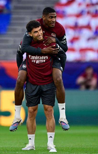 Arsenal's Spanish defender #36 Martin Zubimendi carries Arsenal's Spanish defender #03 Cristhian Mosquera during a MD-1 training session at the Puskas Arena in Budapest on May 29, 2026, on the eve of the UEFA Champions League final football match between Paris Saint-Germain (PSG) and Arsenal FC. Paris Saint-Germain (PSG) face Arsenal in the UEFA Champions League final football match on May 30, 2026 in Budapest. (Photo by INA FASSBENDER / AFP)