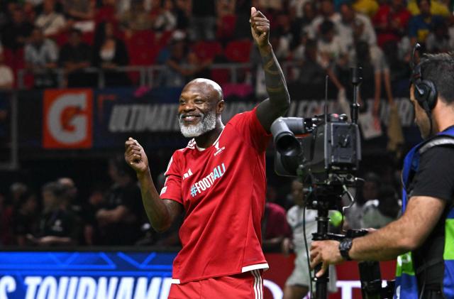 French football coach William Gallas dances prior to the final football match of the Ultimate Champions Legends Tournament at the Papp Laszlo Arena in Budapest on May 29, 2026, on the eve of the UEFA Champions League final. (Photo by Attila KISBENEDEK / AFP)