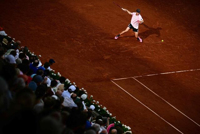 US Tommy Paul plays a forehand return to Norway's Casper Ruud during their men's singles match on day 6 of the French Open tennis tournament on Court Suzanne-Lenglen at the Roland-Garros Complex in Paris on May 29, 2026. (Photo by JULIEN DE ROSA / AFP)