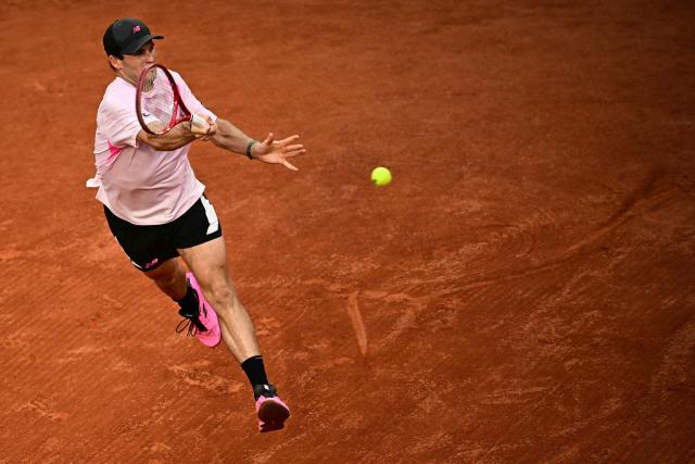 US Tommy Paul plays a forehand return to Norway's Casper Ruud during their men's singles match on day 6 of the French Open tennis tournament on Court Suzanne-Lenglen at the Roland-Garros Complex in Paris on May 29, 2026. (Photo by JULIEN DE ROSA / AFP)