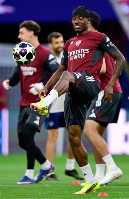 Arsenal's English midfielder #20 Noni Madueke plays the ball during a MD-1 training session at the Puskas Arena in Budapest on May 29, 2026, on the eve of the UEFA Champions League final football match between Paris Saint-Germain (PSG) and Arsenal FC. Paris Saint-Germain (PSG) face Arsenal in the UEFA Champions League final football match on May 30, 2026 in Budapest. (Photo by INA FASSBENDER / AFP)