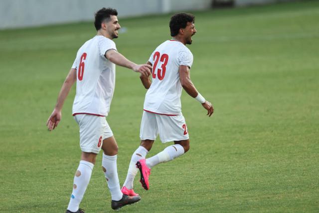 Iran's Forward #23 Rezaeian Ramin celebrates with teammates after scoring their side's second goal during an international friendly football match between Iran and Gambia, in Antalya, southern Turkey, May 29, 2026, as part of Iran's preparation for the upcoming football World Cup. (Photo by Oner SAN / AFP)