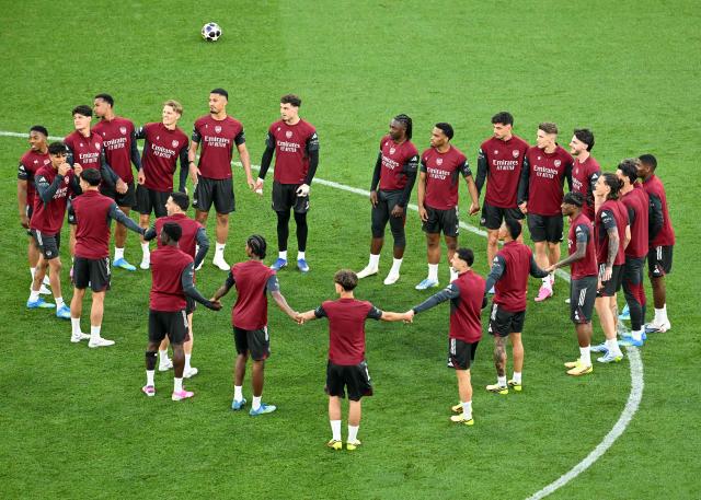 Arsenal's players gather during a MD-1 training session at the Puskas Arena in Budapest on May 29, 2026, on the eve of the UEFA Champions League final football match between Paris Saint-Germain (PSG) and Arsenal FC. Paris Saint-Germain (PSG) face Arsenal in the UEFA Champions League final football match on May 30, 2026 in Budapest. (Photo by NICOLAS TUCAT / AFP)