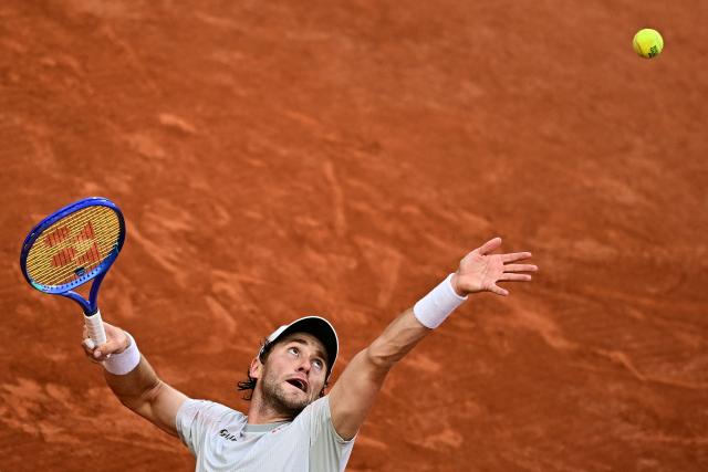Norway's Casper Ruud serves to US Tommy Paul during their men's singles match on day 6 of the French Open tennis tournament on Court Suzanne-Lenglen at the Roland-Garros Complex in Paris on May 29, 2026. (Photo by JULIEN DE ROSA / AFP)
