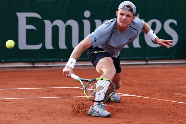 Netherlands' Jesper de Jong hits a half volley to Karen Khachanov during their men's singles match on day 6 of the French Open tennis tournament at the Roland-Garros Complex in Paris on May 29, 2026. (Photo by Anne-Christine POUJOULAT / AFP)