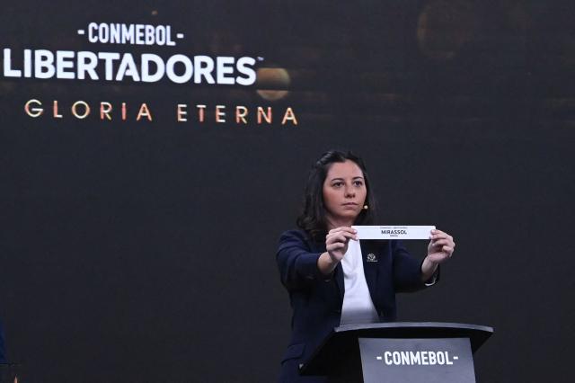 CONMEBOL Competition Manager Luciana Antunez shows the slip of Brazil's Mirassol during the Copa Libertadores round of 16 draw in Luque, Paraguay, on May 29, 2026. (Photo by DANIEL DUARTE / AFP)