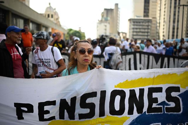 Retirees, pensioners and elderly people take part in a protest demanding better living conditions and higher pensions on Venezuela’s National Older Adults Day, in Caracas, on May 29, 2026. (Photo by Federico PARRA / AFP)