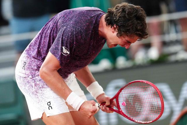 Brazil's Joao Fonseca celebrates after winning against Serbia's Novak Djokovic at the end of their men's singles match on day 6 of the French Open tennis tournament on Court Philippe-Chatrier at the Roland-Garros Complex in Paris on May 29, 2026. (Photo by Dimitar DILKOFF / AFP)