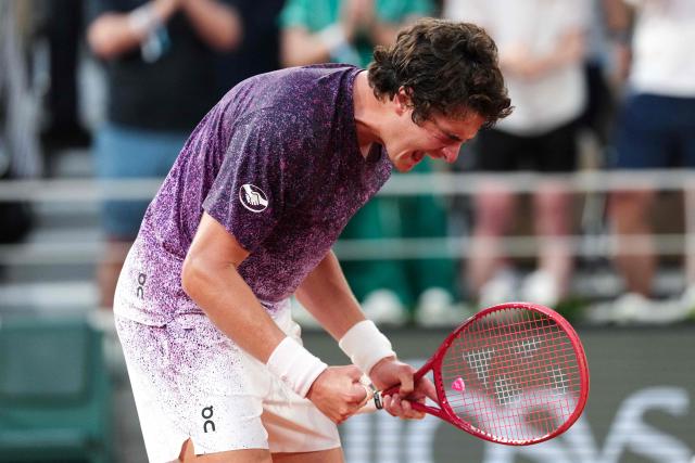 Brazil's Joao Fonseca celebrates after winning against Serbia's Novak Djokovic at the end of their men's singles match on day 6 of the French Open tennis tournament on Court Philippe-Chatrier at the Roland-Garros Complex in Paris on May 29, 2026. (Photo by Dimitar DILKOFF / AFP)