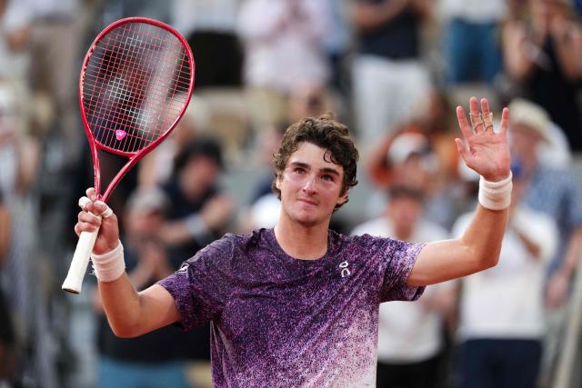 Brazil's Joao Fonseca celebrates after winning against Serbia's Novak Djokovic at the end of their men's singles match on day 6 of the French Open tennis tournament on Court Philippe-Chatrier at the Roland-Garros Complex in Paris on May 29, 2026. (Photo by Dimitar DILKOFF / AFP)