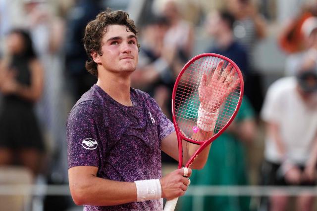 Brazil's Joao Fonseca celebrates after winning against Serbia's Novak Djokovic at the end of their men's singles match on day 6 of the French Open tennis tournament on Court Philippe-Chatrier at the Roland-Garros Complex in Paris on May 29, 2026. (Photo by Dimitar DILKOFF / AFP)