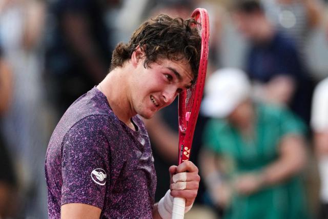 Brazil's Joao Fonseca celebrates after winning against Serbia's Novak Djokovic at the end of their men's singles match on day 6 of the French Open tennis tournament on Court Philippe-Chatrier at the Roland-Garros Complex in Paris on May 29, 2026. (Photo by Dimitar DILKOFF / AFP)
