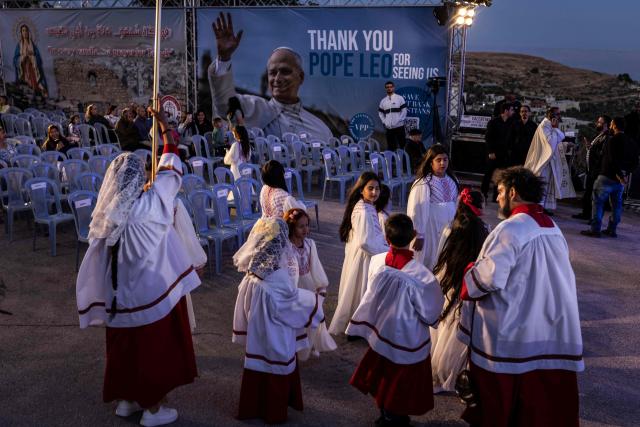 Alter boys and girls gather during the Marian Festival, which honors the Virgin Mary, in the Israeli-occupied West Bank village of Taybeh on May 29, 2026. At least 1,073 Palestinians, including several armed fighters, have been killed by Israeli soldiers or settlers in the West Bank since the outbreak of the Gaza war following Hamas's attack on 7 October 2023, according to an AFP tally based on Palestinian Authority data. On the other hand, official Israeli data shows at least 46 Israelis -- civilians and soldiers -- have been killed in Palestinian attacks or during Israeli military operations in the same period. (Photo by JOHN WESSELS / AFP)