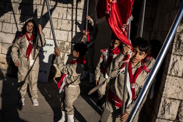 Members of the Palestinian church scouts group prepares for their procession ahead of the Marian Festival, which honors the Virgin Mary, in the Israeli-occupied West Bank village of Taybeh on May 29, 2026. At least 1,073 Palestinians, including several armed fighters, have been killed by Israeli soldiers or settlers in the West Bank since the outbreak of the Gaza war following Hamas's attack on 7 October 2023, according to an AFP tally based on Palestinian Authority data. On the other hand, official Israeli data shows at least 46 Israelis -- civilians and soldiers -- have been killed in Palestinian attacks or during Israeli military operations in the same period. (Photo by JOHN WESSELS / AFP)