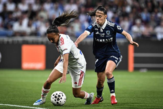 Lyon’s French defender #04 Selma Bacha (L) fights for the ball with Paris FC’s French midfielder #07 Maelle Garbino (R) during the French women L1 football final match between OL Lyonnes and Paris FC at the Groupama stadium in Decines-Charpieu, central-eastern France, on May 29, 2026. (Photo by JEFF PACHOUD / AFP)